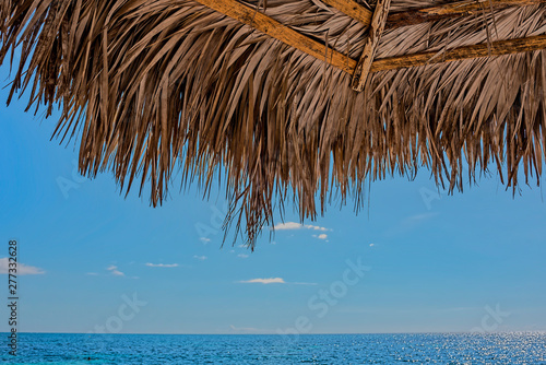 Canvas Print tropical beach with umbrella