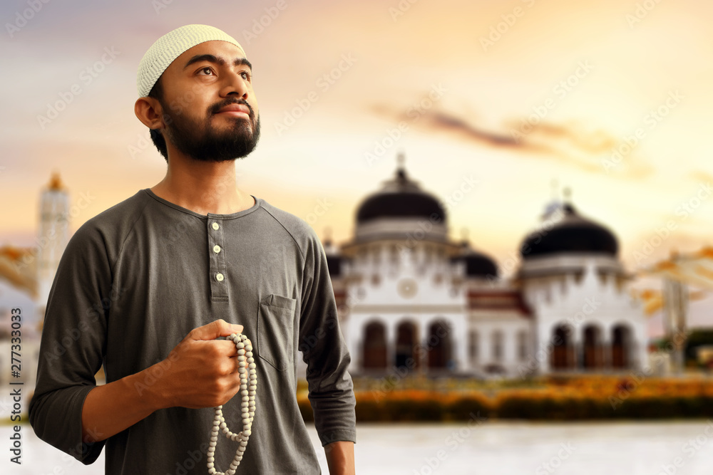 Religious asian muslim man with rosary beads Religious asian muslim man with rosary beads