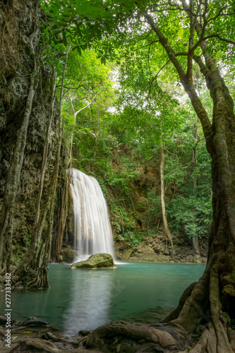 Clean green emerald water from the waterfall Surrounded by small trees - large trees   green colour  Erawan waterfall  Kanchanaburi province  Thailand