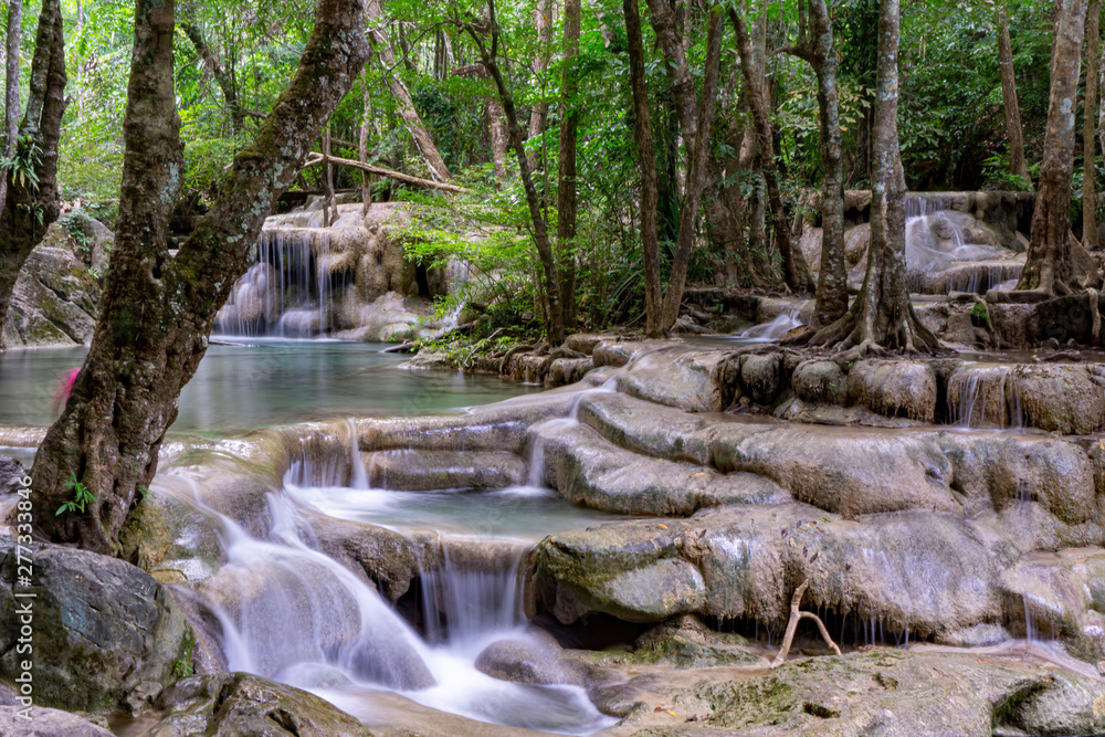 Clean green emerald water from the waterfall Surrounded by small trees - large trees, green colour, Erawan waterfall, Kanchanaburi province, Thailand Clean green emerald water from the waterfall Surrounded by small trees - large trees, green colour, Erawan waterfall, Kanchanaburi province, Thailand