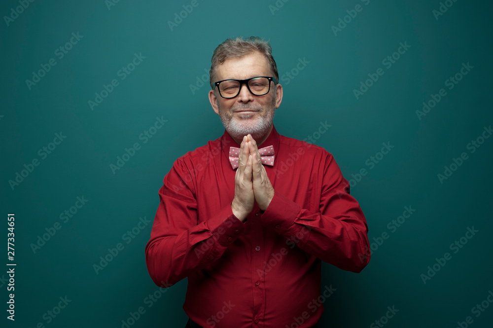 Positive elderly man cupped hands in front of him Positive elderly man cupped hands in front of him