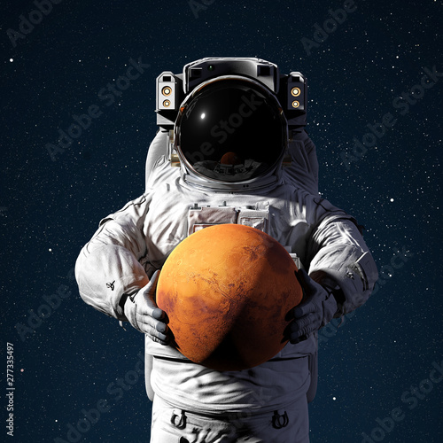Fototapeta Naklejka Na Ścianę i Meble -  astronaut holding planet Mars, world of the solar system