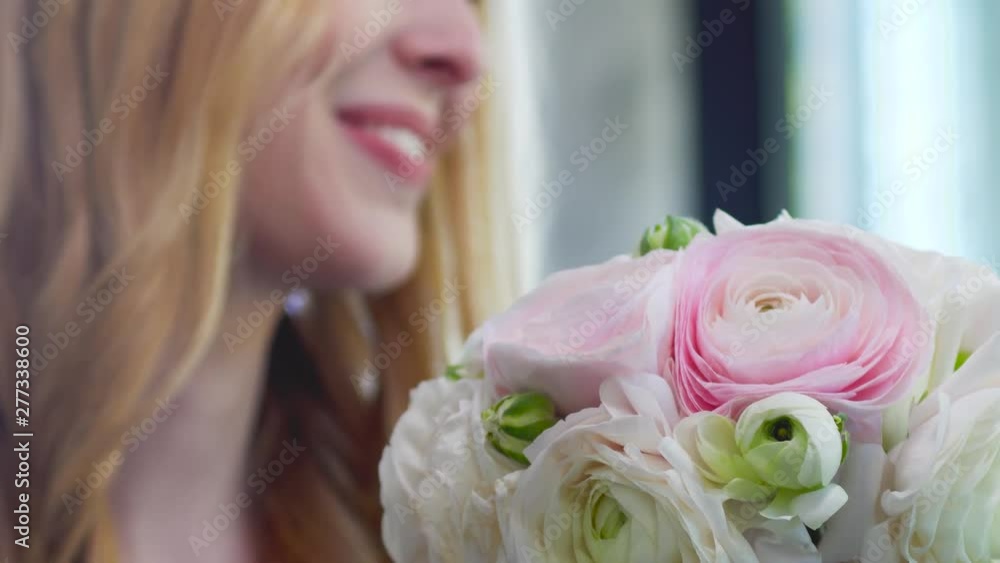 girl is happy to receive fresh flowers. female smile and pink and white roses girl is happy to receive fresh flowers. female smile and pink and white roses