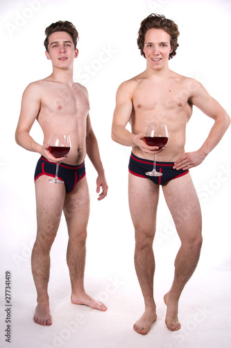 Two young sexy guys and a holiday. Red wine.