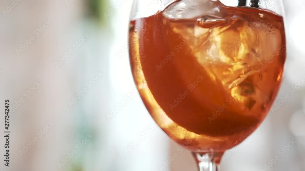 ice cubes in a glass with cocktail ice cubes in a glass with cocktail
