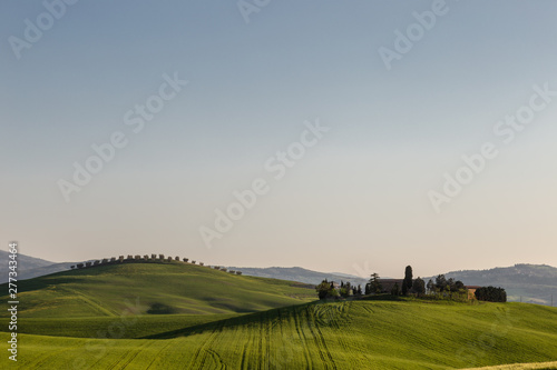 Beautiful Tuscany landscape in spring time with wave green hills. Tuscany, Italy, Europe