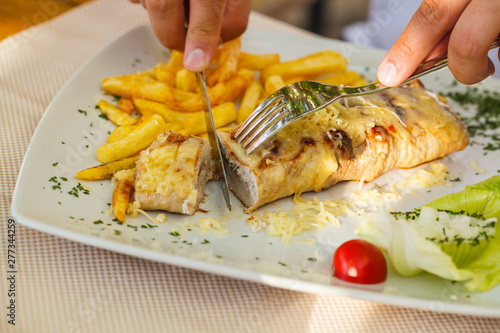 Traditional Montenegrin Meat Negush Steak on white plate in a restaurant. photo