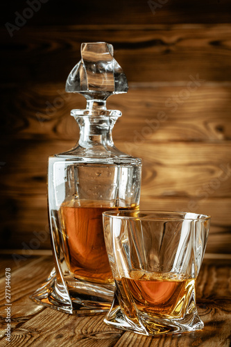glasses with cognac, whiskey stand on the bar