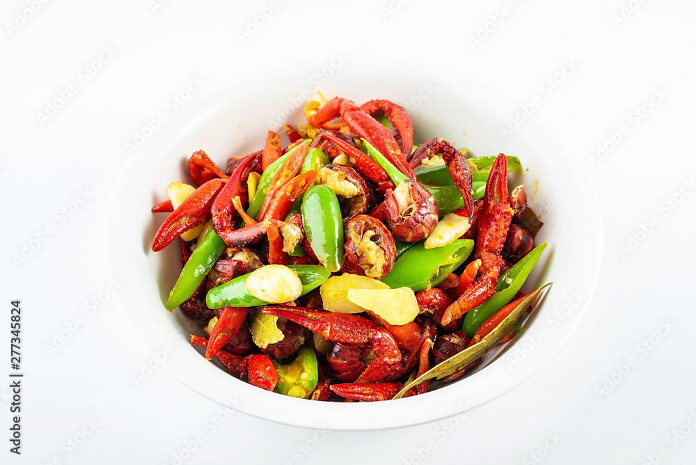 Delicious braised crayfish in a bowl on white background Delicious braised crayfish in a bowl on white background