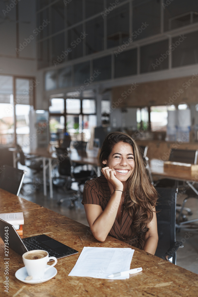 Vertical shot delighted carefree charming female entrepreneur take break drink coffee laughing happily smiling talking coworker studying co-working cafe, freelancing use laptop, study papers Vertical shot delighted carefree charming female entrepreneur take break drink coffee laughing happily smiling talking coworker studying co-working cafe, freelancing use laptop, study papers