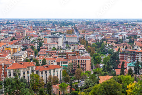 Aerial view of Bergamo city, Lombardy, Italy. Central street Viale Roma and Bergamo Central Railway station in the end of the street on background © katatonia