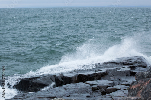 Waves of Lake Superior crashing on rocky shore