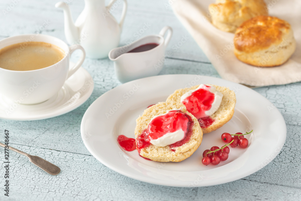 Classic scones with cream and berry jam Classic scones with cream and berry jam