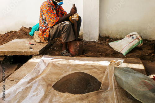 In Africa, Hard work Congolese grounding Coltan Ore. Widely Used in the Most Modern Technology