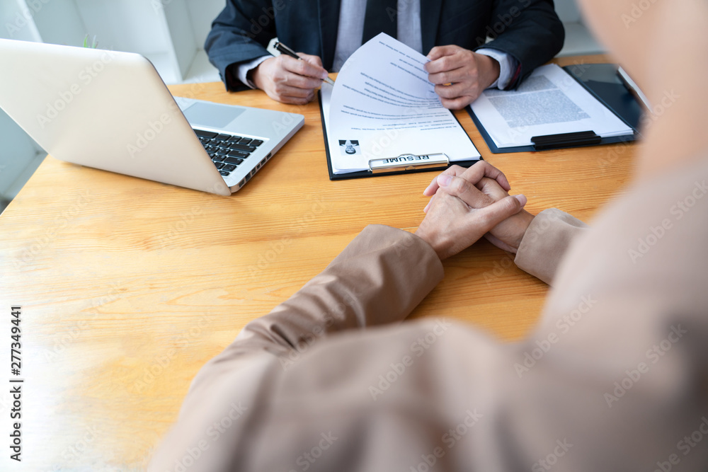 businessman professional women in suit explaining about her profile to business managers holding reading a resume, interview the job hiring career and placement concept businessman professional women in suit explaining about her profile to business managers holding reading a resume, interview the job hiring career and placement concept