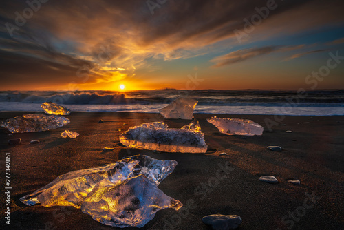 Diamond beach, South Iceland - February 27, 2019 : Sunrise at Diamond beach, near Jokulsarlon glacier lagoon