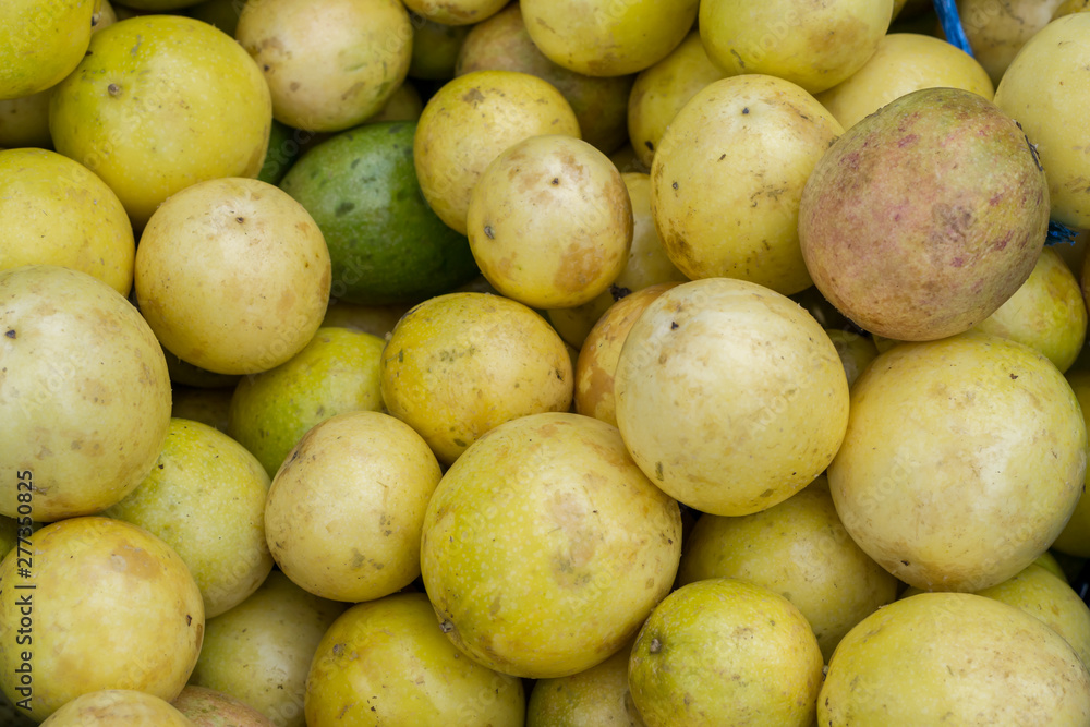 Fresh Passion fruit background for sale at local market in Thailand Fresh Passion fruit background for sale at local market in Thailand