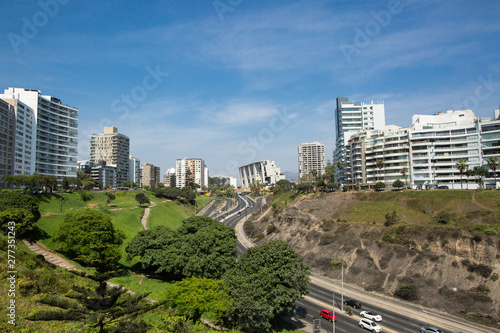 Lima, Peru. Traffic and tall buildings along the main street of the capital 