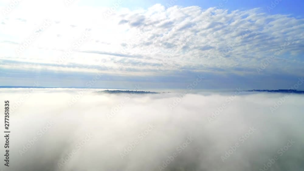 Aerial view of mountains, hills hidden in soft white clouds. 4K. Aerial view of mountains, hills hidden in soft white clouds. 4K.