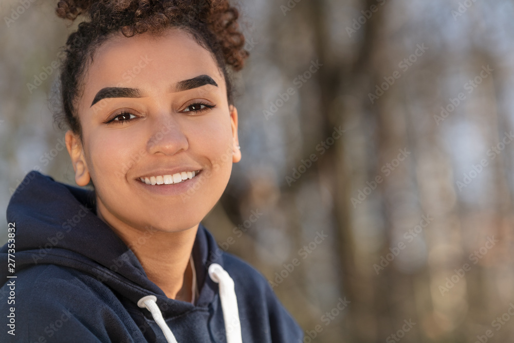 Happy Biracial Mixed Race African American Girl Teenager Smiling With Perfect Teeth Happy Biracial Mixed Race African American Girl Teenager Smiling With Perfect Teeth