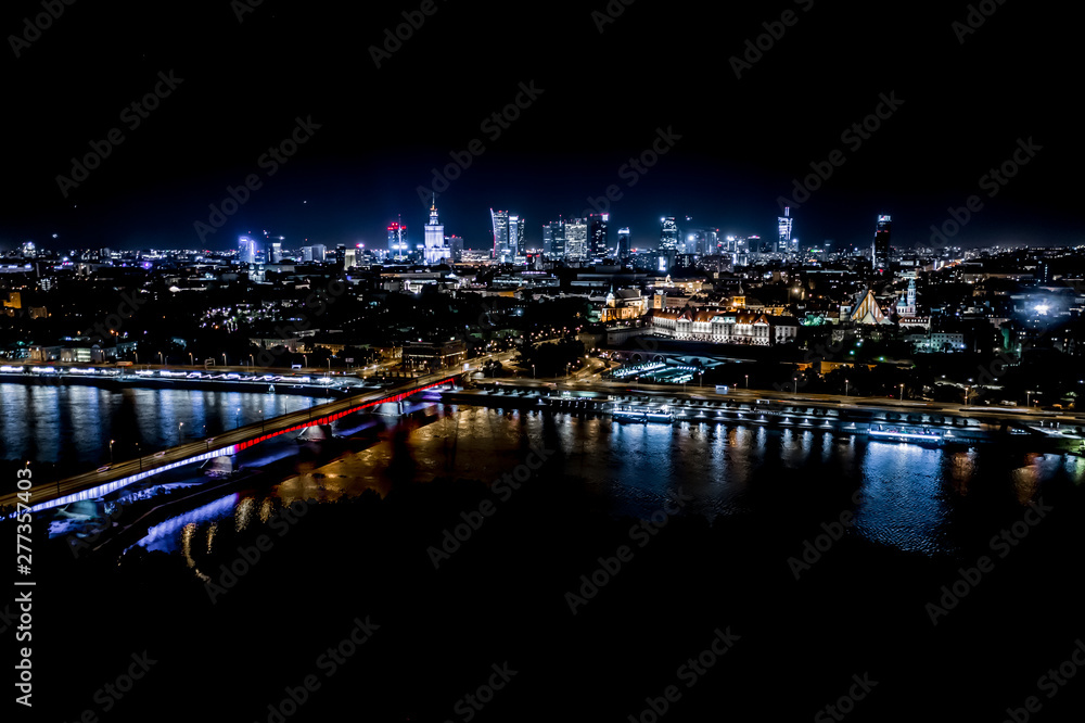 Night city skyline background. Aerial view of Warsaw capital city of  Poland. From above, night city view with night sky. Night panorama of  Warsaw cityscape. Aerial View Stock Photo | Adobe Stock