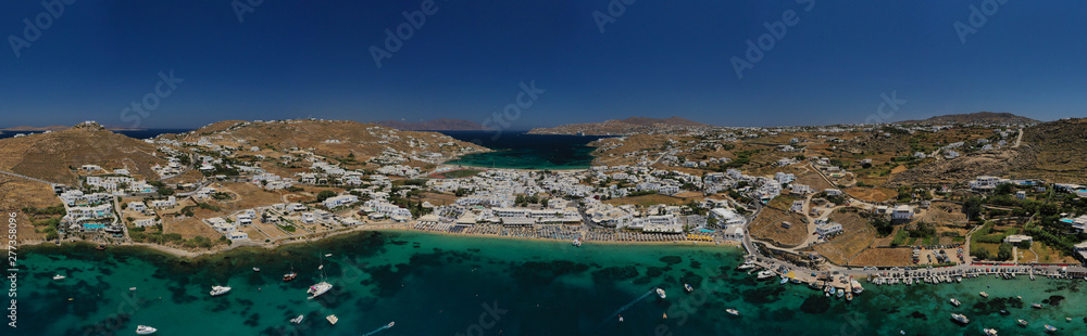 Aerial drone photo of paradise celebrity bay of Ornos famous for pool resorts and sandy turquoise organised clear sea beach, Mykonos island, Cyclades, Greece Aerial drone photo of paradise celebrity bay of Ornos famous for pool resorts and sandy turquoise organised clear sea beach, Mykonos island, Cyclades, Greece