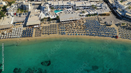 Aerial drone photo of paradise celebrity bay of Ornos famous for pool resorts and sandy turquoise organised clear sea beach, Mykonos island, Cyclades, Greece © aerial-drone