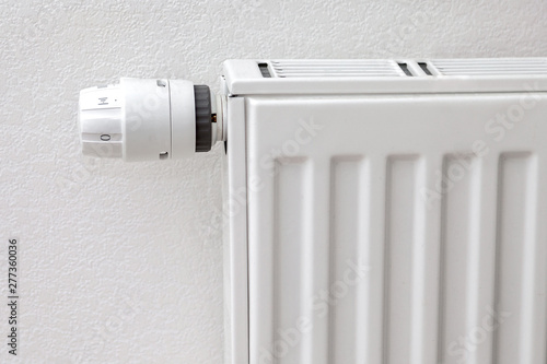 Wallpaper Mural white temperature control knob on white radiator. metal radiator on the front of a white wall Torontodigital.ca