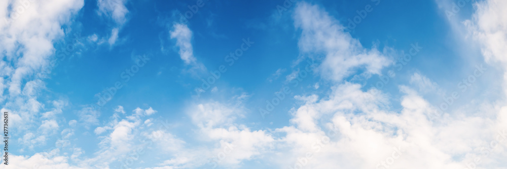 White clouds on a blue sky as background White clouds on a blue sky as background