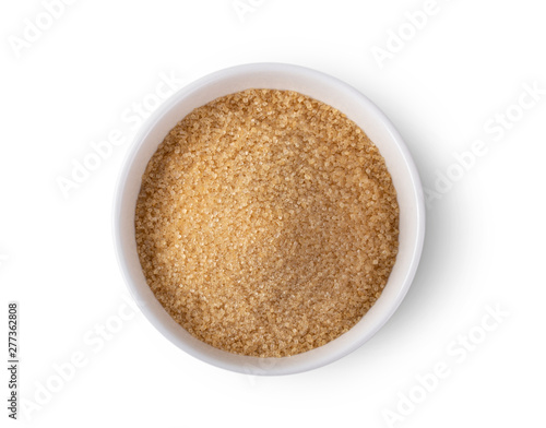 brown sugar in a bowl isolated on white background. Top view