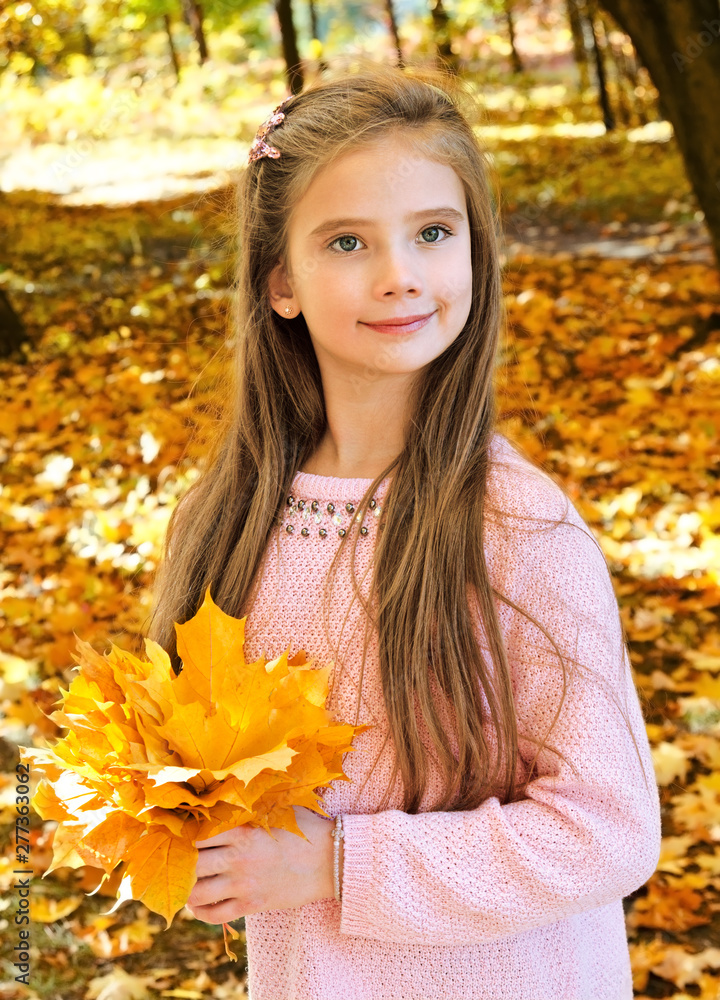 Autumn portrait of adorable smiling little girl child with leaves Autumn portrait of adorable smiling little girl child with leaves