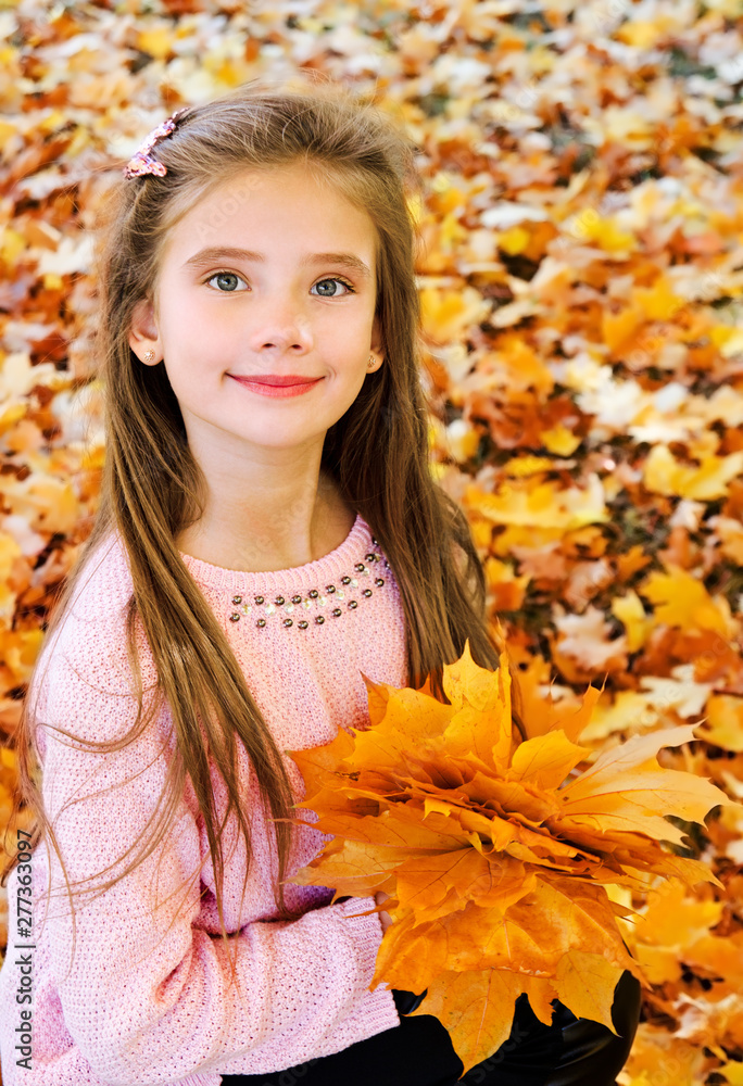 Autumn portrait of adorable smiling little girl child with leaves Autumn portrait of adorable smiling little girl child with leaves