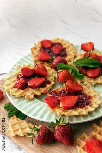 Viennese waffles with strawberries on a gray background. food photography