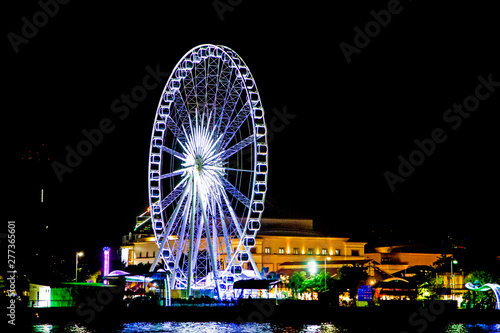 Ferris wheel  colorful lights at night.