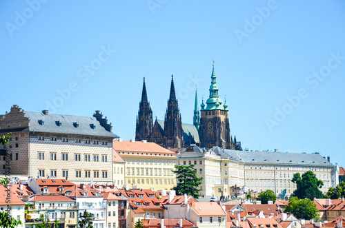 Amazing view of Prague Castle and St. Vitus Cathedral in Prague, Czech Republic photographed on a clear day with historical buildings around the castle. Czech capital, tourist place. Bohemia, Czechia