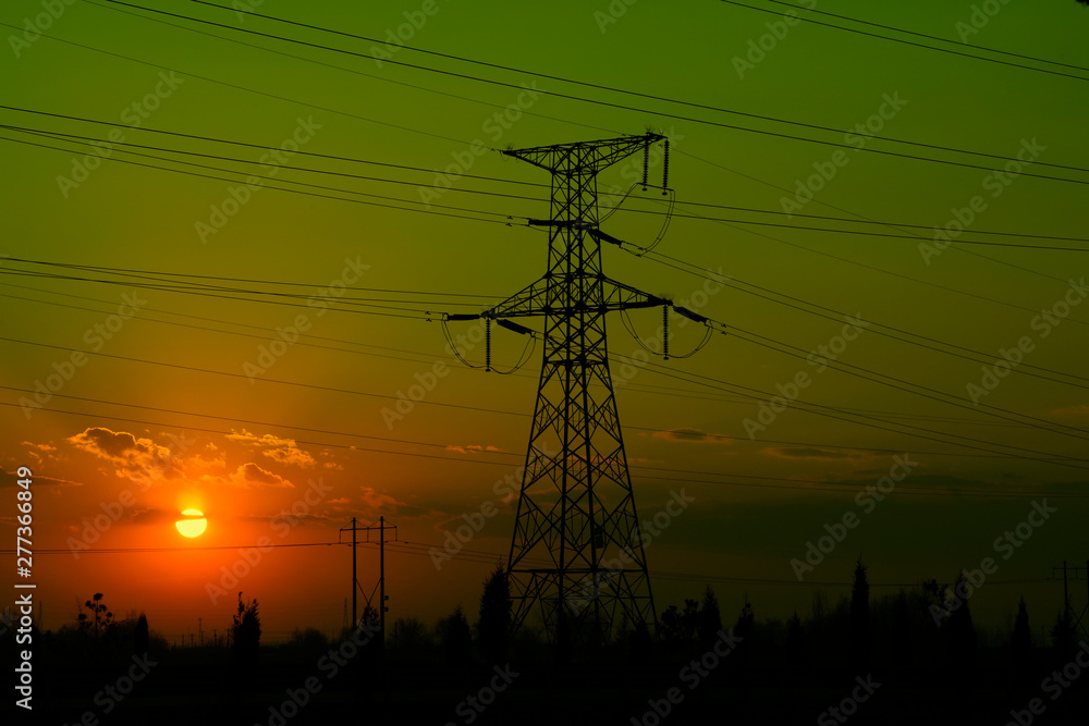Fototapeta premium electric tower in the setting sun