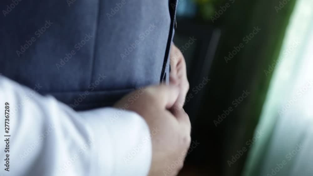 Business man dressing up with classic, elegant shoes. Groom wearing shoes on wedding day, tying the laces and preparing. Black and white photo Business man dressing up with classic, elegant shoes. Groom wearing shoes on wedding day, tying the laces and preparing. Black and white photo