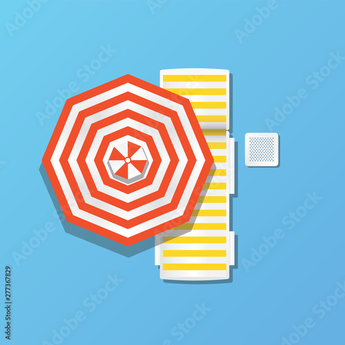 white deck chair for the beach and umbrella in orange
