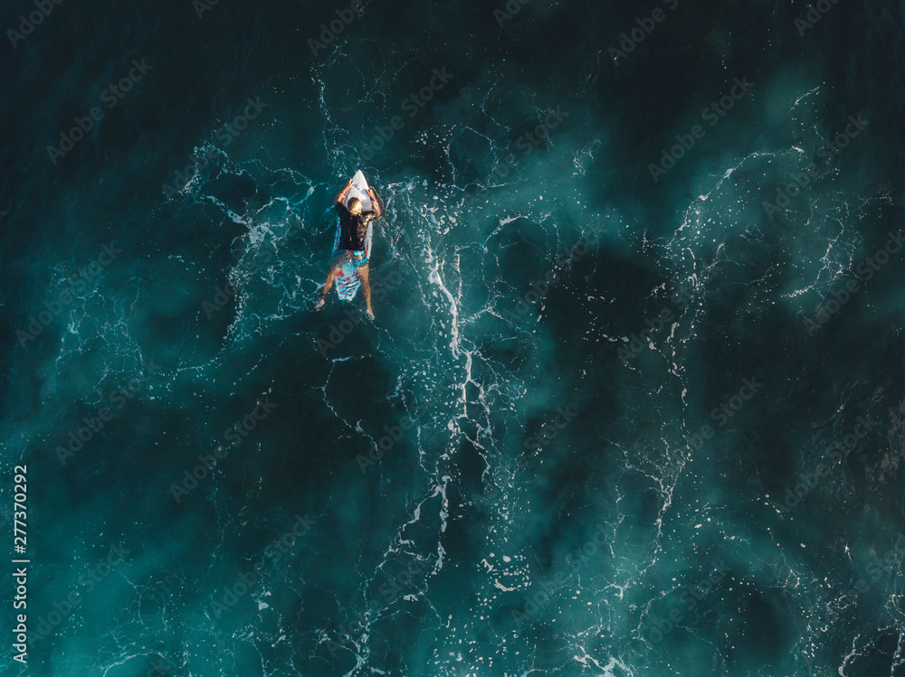 Fototapeta premium Aerial view of surfer