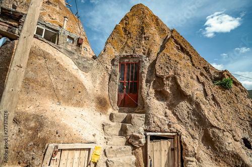 close up view on courtyard and interior of traditional Iranian ancient cave village of troglodyte in Kandovan in East Azerbaijan Province. Iran. near Tabriz city. looks like village in Turkey photo