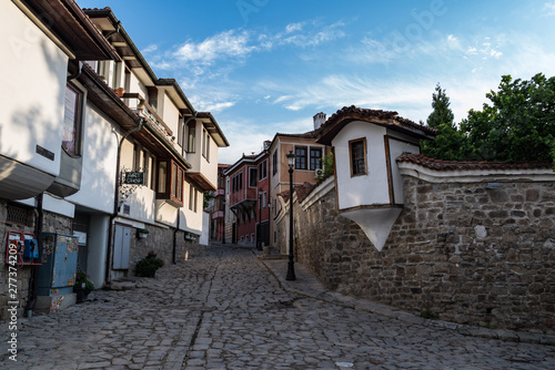  View of a narrow street in historical part of Plovdiv Old Town. Typical medieval colorful buildings. Bulgaria
