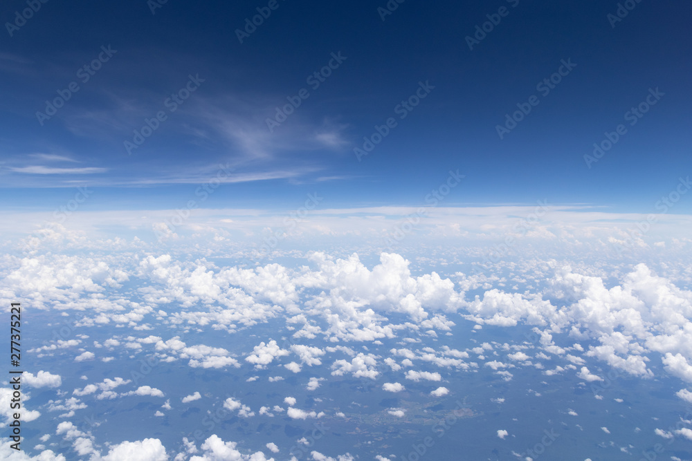Blue sky background and white clouds soft focus.Aerial veiw landscape from airplane window. Blue sky background and white clouds soft focus.Aerial veiw landscape from airplane window.