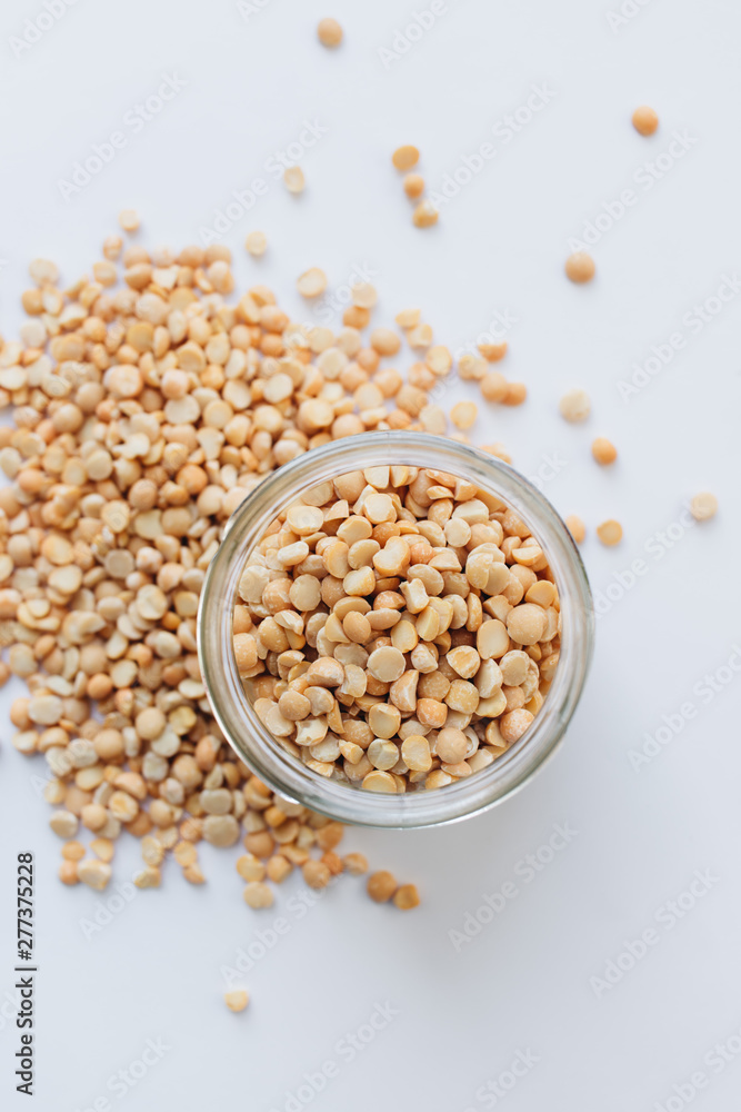 Glass jar with raw dry peas, macro Glass jar with raw dry peas, macro