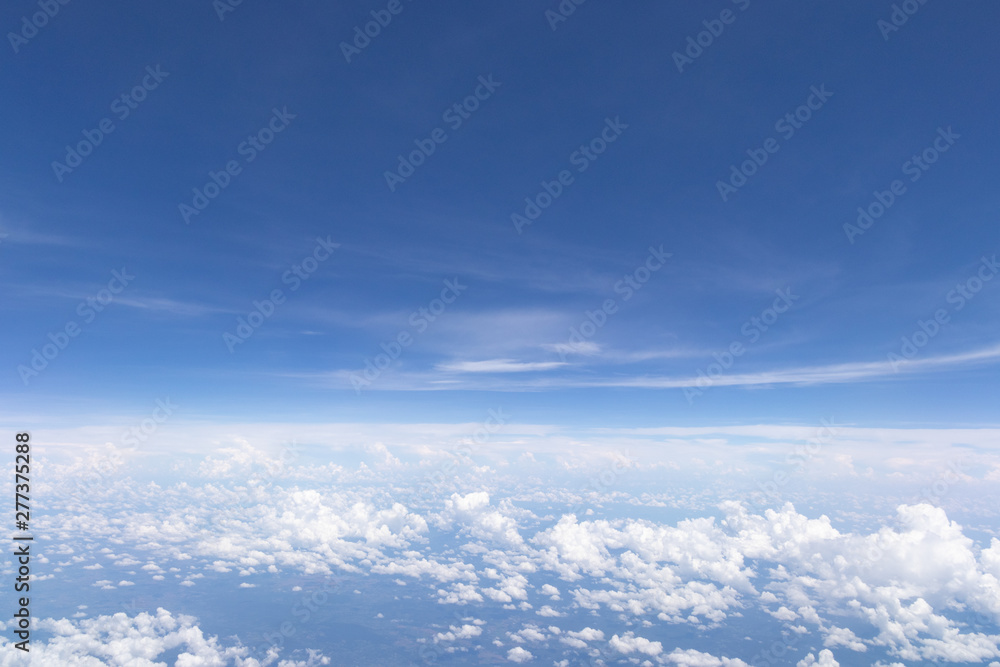 Blue sky background and white clouds soft focus.Aerial veiw landscape from airplane window. Blue sky background and white clouds soft focus.Aerial veiw landscape from airplane window.