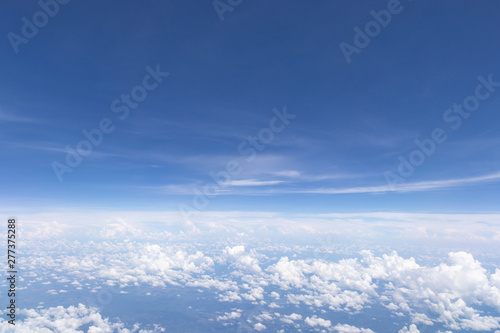 Blue sky background and white clouds soft focus.Aerial veiw landscape from airplane window.