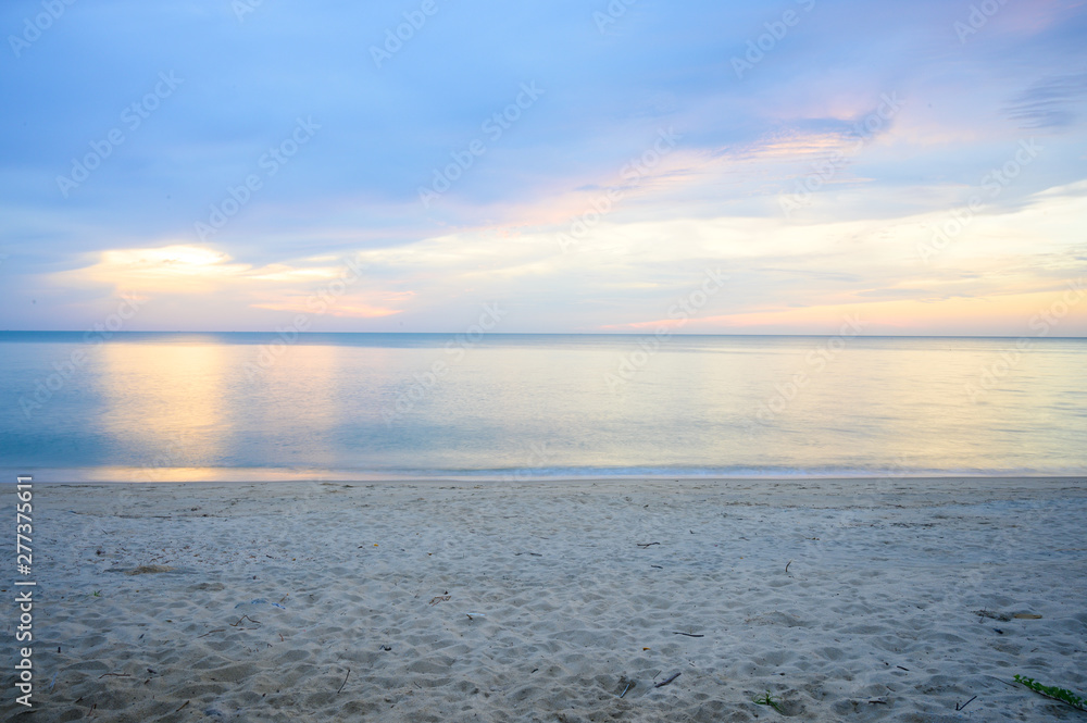 Landscape of sandy beach with soft wave and sunrise sky with cloud Landscape of sandy beach with soft wave and sunrise sky with cloud