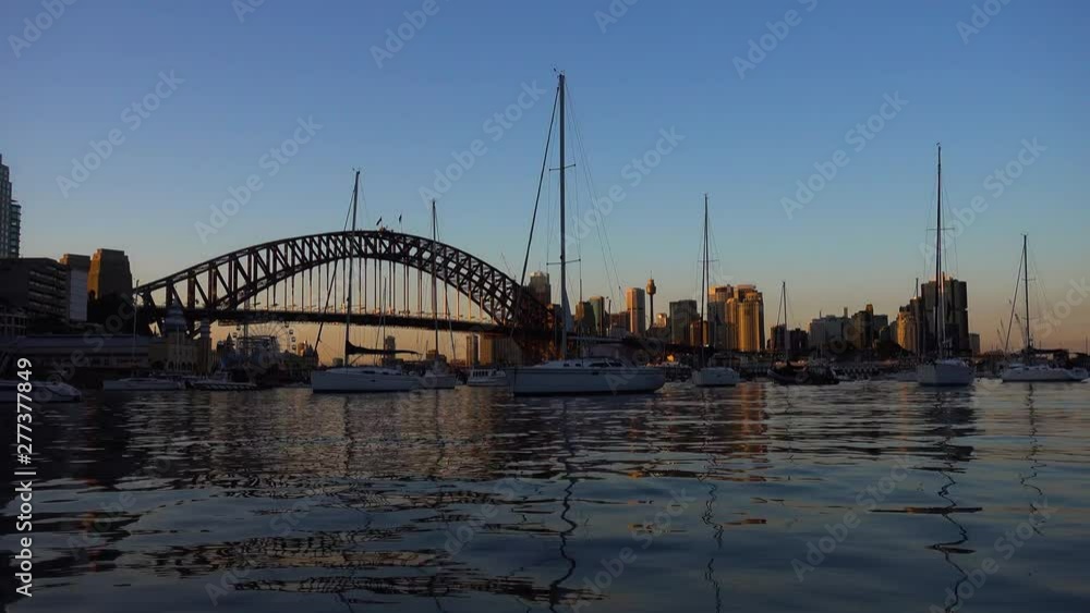 Harbour bridge time lapse in front of Sidney skyline with sailboats in front Harbour bridge time lapse in front of Sidney skyline with sailboats in front