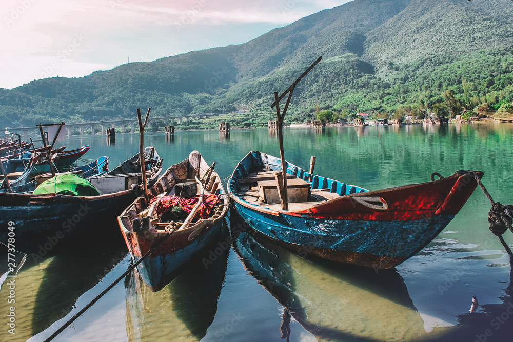 Wooden boats lined up at fishing village Lang Co, Hue, Vietnam.