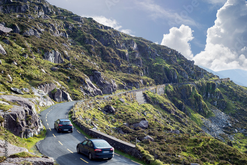 mountains and cliff road traffic at the conor pas photo