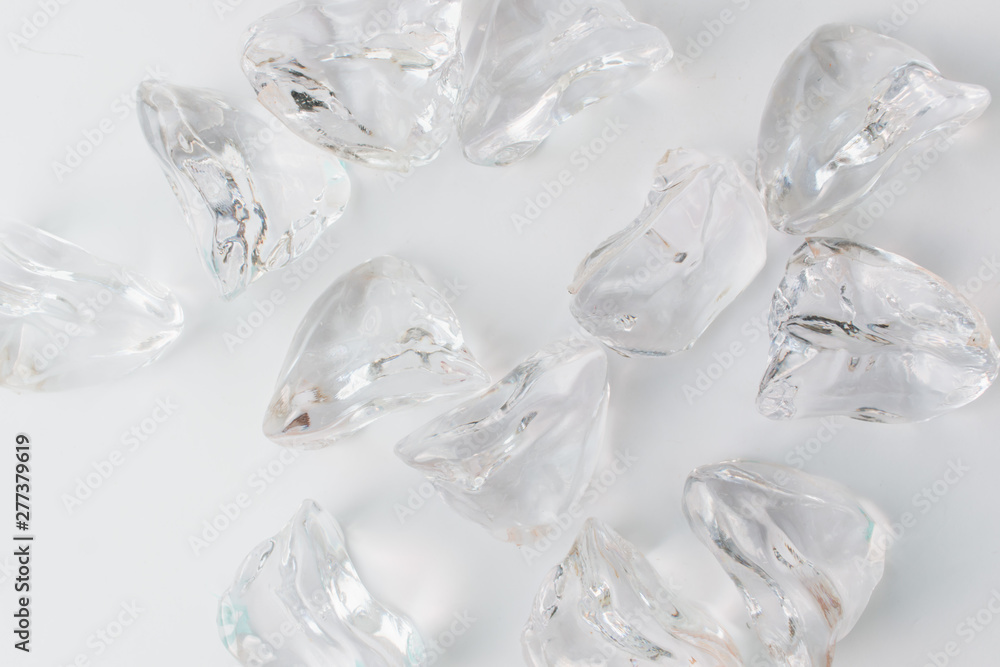 Scattered crystals on white background, beautiful gems Scattered crystals on white background, beautiful gems